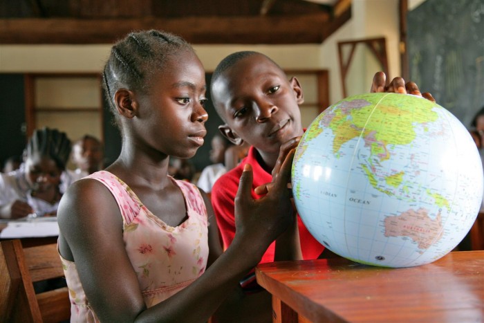 (Right-left) Wonder Tokpah, 12, and a classmate search for countries on a globe at the UNICEF-supported Ganta Public School, in Ganta Town, Nimba County. While overcrowded public schools with inadequate staff and infrastructure are the norm, the Ganta Public School is part of an initiative to build high-quality educational facilities. The campus is equipped with well-ventilated classrooms, playgrounds, solar-powered electricity, computer laboratories, a clinic and a cafeteria, where students are served a free lunch. The school is also supported by the Government of the Netherlands. The county hosts approximately 54,000 refugees who have fled fighting in Côte dIvoire since February 2011. In October 2011, Liberia is still recovering from a ruinous 14-year civil war that ended in 2003. Although the Government is working to rebuild the countrys destroyed infrastructure, many Liberians continue to live without access to basic services. The influx of approximately 178,000 refugees from Côte d'Ivoire, who fled their own country after controversy surrounding the 28 November 2010 presidential election turned violent, has only exacerbated the situation. Waning supplies of safe drinking water and food, inadequate sanitation facilities, constricted access to medical care and overcrowding all threaten the health of Liberian and Ivorian children alike. The education of many children has also been disrupted because refugees stay in schools when there are not enough families to host them. UNICEF supports basic health, nutritional and educational services  as well as the WASH (water, sanitation and hygiene) programme  for Liberian and refugee children and their families. Still, the poor condition of roads makes it difficult for such aid to reach remote areas, where many of the most vulnerable families live. As of November 2011, many of the refugees have returned home, but an estimated 138,000 remain in Liberia, continuing to exhaust already limited resources. To continue providing life-saving services through the end of the year, UNICEF still needs US$17 million of the $29 million required by its Emergency Humanitarian Action Plan for Liberia.